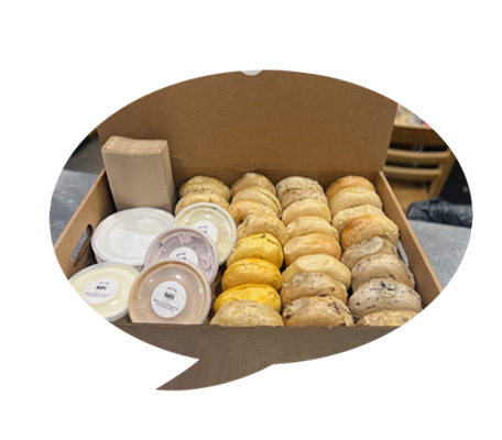 A box of bagel items including 2 dozen bagels and some cream cups.